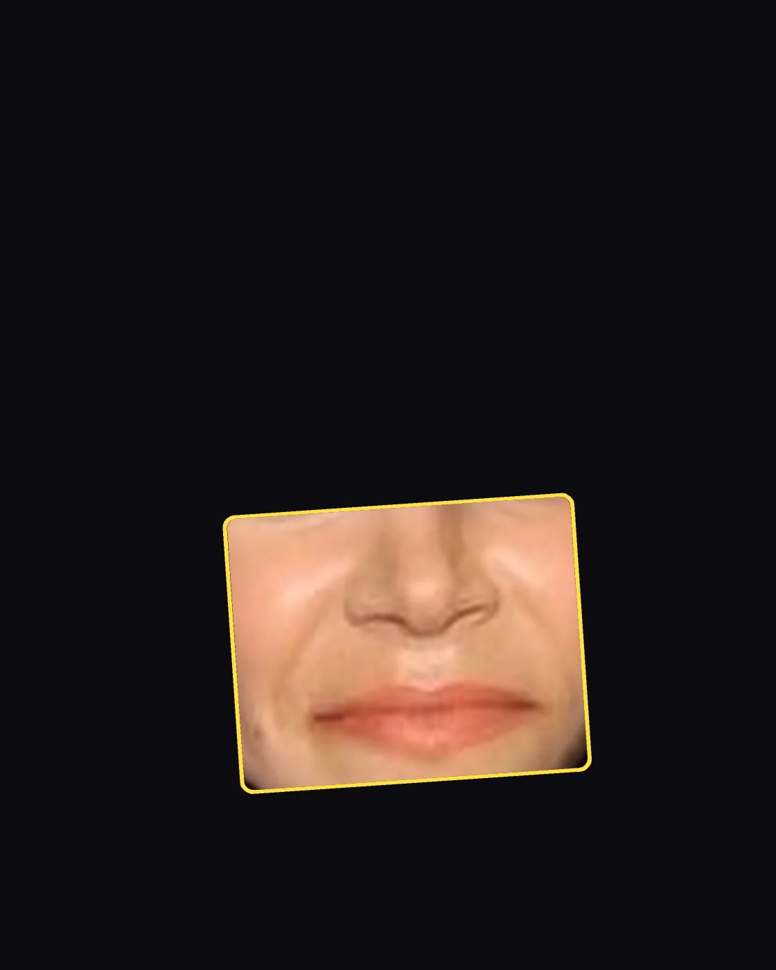 Close crop of a famous person’s nose and jawline
