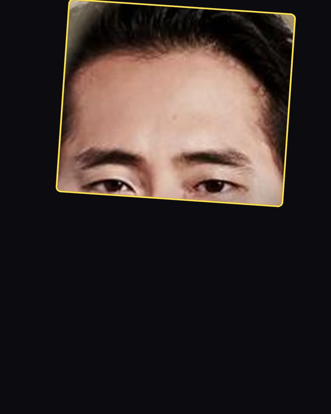 Close crop of a famous person’s hair and forehead
