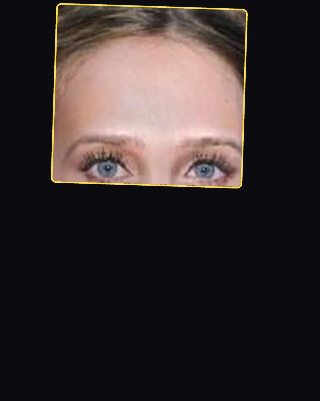 Close crop of a famous person’s hair and forehead