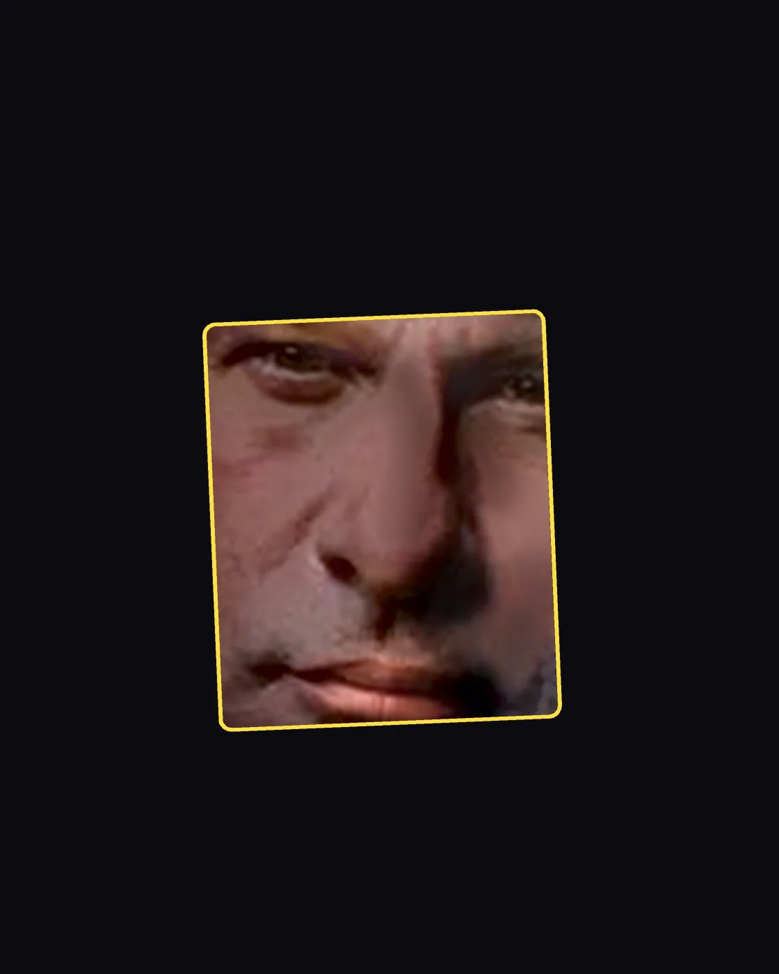 Close crop of a famous person’s nose and jawline