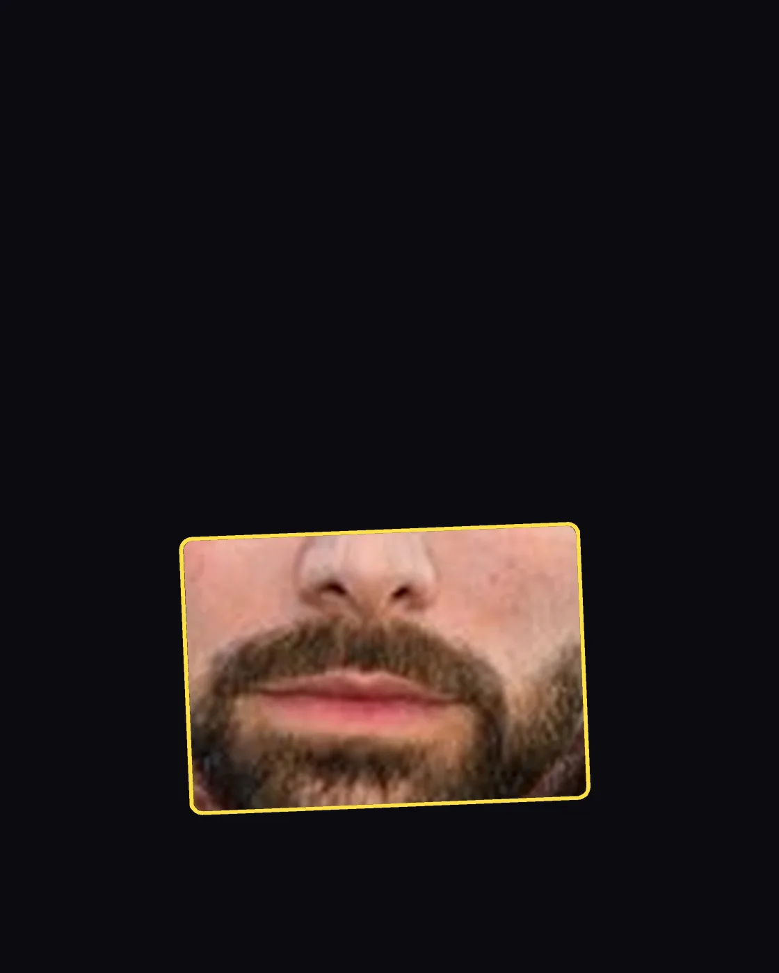 Close crop of a famous person’s nose and jawline
