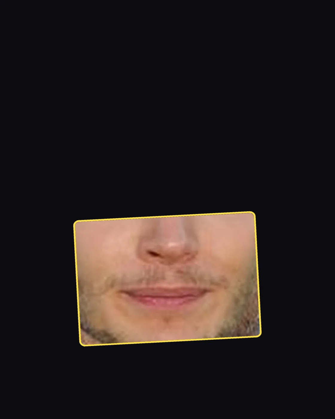 Close crop of a famous person’s nose and jawline